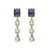 Σκουλαρίκια κρεμαστά Victoria Cruz από ασήμι 925 A4710-12DT 1 serenity gold plated long earrings with purple crystal in rectangle shape conv Σκουλαρίκια κρεμαστά Victoria Cruz από ασήμι 925 A4710-12DT watchbox.gr